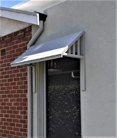 apm_shingle_awning_over_door